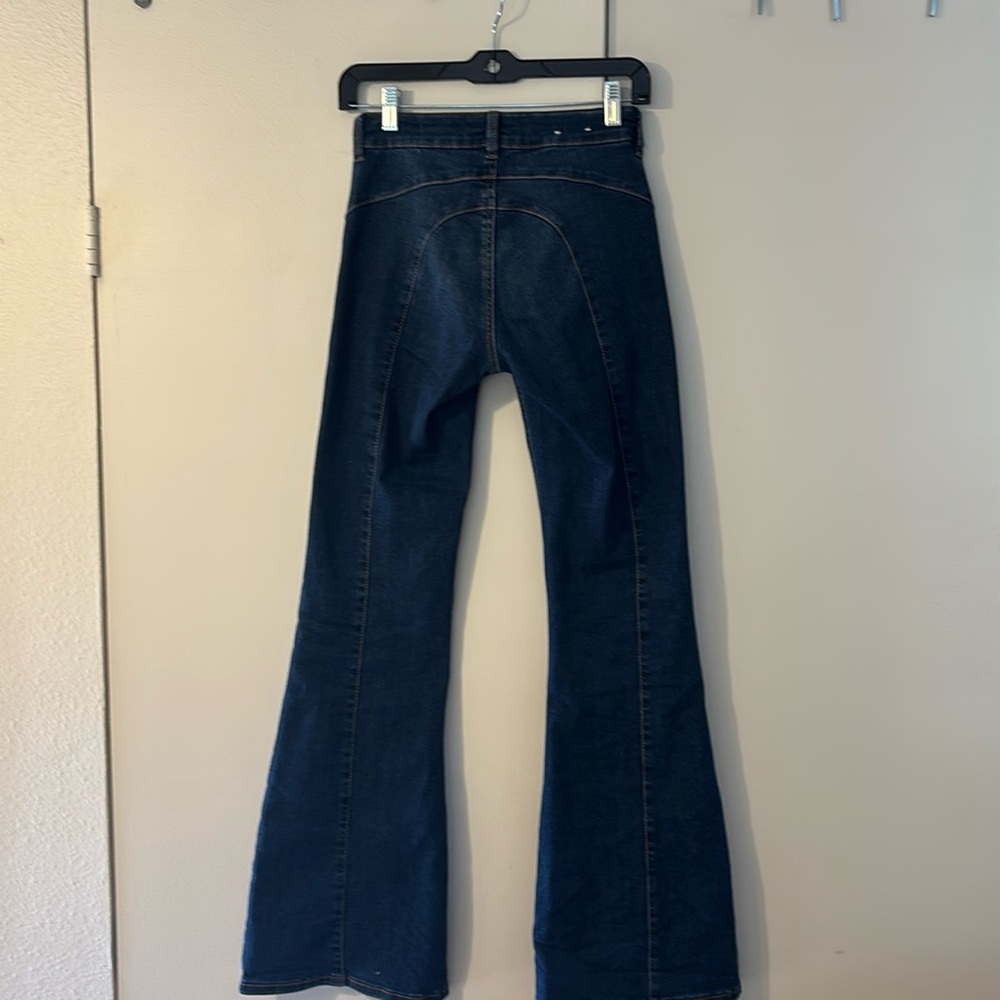 Like new Garage Denim low rise flare in medium color wash